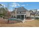 Spacious backyard featuring a pool, patio area, mature trees, and well-maintained lawn at 3759 Chapel Cv, Douglasville, GA 30135
