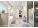 Bathroom with tile floor, a glass shower, a vanity, a window, and a stool at 3759 Chapel Cv, Douglasville, GA 30135