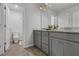 Bright, clean bathroom with double sink vanity, granite countertops and linoleum flooring at 3759 Chapel Cv, Douglasville, GA 30135