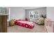Charming bedroom with a racecar-shaped bed, bright windows and light interior at 3759 Chapel Cv, Douglasville, GA 30135