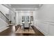 Elegant dining room with hardwood floors, wainscoting, and a bright window at 3759 Chapel Cv, Douglasville, GA 30135
