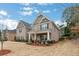 Stunning two-story home featuring a welcoming front porch and manicured landscaping at 3759 Chapel Cv, Douglasville, GA 30135