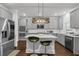 Modern kitchen features gray cabinets, stainless steel appliances, and granite countertops at 3759 Chapel Cv, Douglasville, GA 30135