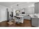 Stylish kitchen with gray cabinets, stainless appliances, and a center island at 3759 Chapel Cv, Douglasville, GA 30135