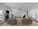 Open concept living room with a stone fireplace and lots of seating at 3759 Chapel Cv, Douglasville, GA 30135