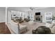 Large living room features a stone fireplace, ceiling fan, and gray walls at 3759 Chapel Cv, Douglasville, GA 30135