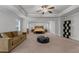 Large main bedroom featuring tray ceilings, seating area, and two large windows at 3759 Chapel Cv, Douglasville, GA 30135