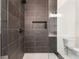 Stylish bathroom showcasing a glass shower with dark accents and a modern toilet at 6178 Lake Lanier Heights Road, Buford, GA 30518