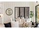 Dining area showcasing stylish decor, large windows, and ample natural light at 6178 Lake Lanier Heights Road, Buford, GA 30518
