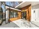 Contemporary home with stylish wood and white siding, black trim, and ample parking at 6178 Lake Lanier Heights Road, Buford, GA 30518