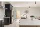 Modern kitchen with stainless fridge, quartz countertop, and eat-in bar at 6178 Lake Lanier Heights Road, Buford, GA 30518