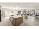 Open concept kitchen has stainless appliances, large island, and living area view at 6178 Lake Lanier Heights Road, Buford, GA 30518