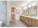 Spa-like main bathroom featuring a double vanity, walk-in closet, and marble shower at 6178 Lake Lanier Heights Road, Buford, GA 30518