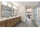 Elegant bathroom with double vanity, marble accents, and access to a glass enclosed shower at 6178 Lake Lanier Heights Road, Buford, GA 30518