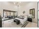 Bright main bedroom features a private balcony, neutral colors, and modern lighting at 6178 Lake Lanier Heights Road, Buford, GA 30518