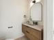 Chic powder room featuring a vessel sink, a decorative mirror, and modern fixtures at 6178 Lake Lanier Heights Road, Buford, GA 30518