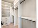 Well-organized walk-in closet with shelving, drawers, and hanging rods for ample storage at 6178 Lake Lanier Heights Road, Buford, GA 30518