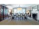 Formal dining room showcasing a large table, elegant chairs, built-in cabinets, and a fireplace mantel at 690 Old Ivy Ne Rd, Atlanta, GA 30342