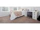Bright bedroom with neutral carpet, a vanity, and natural light through the window at 269 Whitetail Cir, Canton, GA 30115