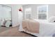 Comfortable bedroom with soft carpet, a large mirror, and bright, natural lighting at 269 Whitetail Cir, Canton, GA 30115