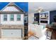 View of the garage and upper story, plus the living room inside with a fireplace at 269 Whitetail Cir, Canton, GA 30115