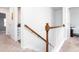 Hallway with a staircase leading to the upper level and a view of the bedroom at 269 Whitetail Cir, Canton, GA 30115