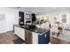 Kitchen island with granite countertop overlooking the living room area at 269 Whitetail Cir, Canton, GA 30115