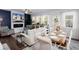 Open-concept living room and dining area with modern furnishings and a fireplace at 269 Whitetail Cir, Canton, GA 30115