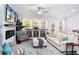 Bright living room with a fireplace, ceiling fan, and plenty of natural light at 269 Whitetail Cir, Canton, GA 30115