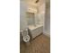 Bathroom featuring neutral walls, walk-in shower, white vanity sink, and vinyl floor at 4112 Bontura Ct, Stone Mountain, GA 30083