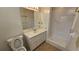 Bathroom with neutral walls, walk-in shower, and a white vanity sink at 4112 Bontura Ct, Stone Mountain, GA 30083