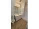 Bathroom with neutral walls, walk-in shower, white vanity sink, and vinyl floor at 4112 Bontura Ct, Stone Mountain, GA 30083