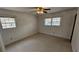 Bedroom featuring neutral walls, carpeted floor, and window views at 4112 Bontura Ct, Stone Mountain, GA 30083