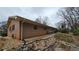 The side of this brick house has a rock garden, and trimmed hedges at 4112 Bontura Ct, Stone Mountain, GA 30083