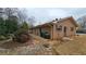 Brick house featuring a side entrance, natural landscaping and stone walkway at 4112 Bontura Ct, Stone Mountain, GA 30083