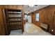An eat-in kitchen with wood paneling, and a window offers a view of the outdoors at 4112 Bontura Ct, Stone Mountain, GA 30083