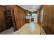 An eat-in kitchen with wood paneling, and a window offers a view of the outdoors at 4112 Bontura Ct, Stone Mountain, GA 30083