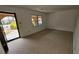 Bright living room with neutral carpet, natural light, and brick entryway at 4112 Bontura Ct, Stone Mountain, GA 30083