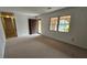 Inviting living room with carpet and natural light streaming through windows at 4112 Bontura Ct, Stone Mountain, GA 30083