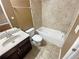 This cozy bathroom features tiled walls, updated vanity with a vessel sink and a soaking tub for relaxation at 4954 Wyeth Way, Alpharetta, GA 30022