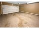 Spacious garage with painted walls and a large garage door at 4954 Wyeth Way, Alpharetta, GA 30022