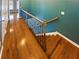 Beautiful hallway with hardwood floors and an iron banister at 4954 Wyeth Way, Alpharetta, GA 30022