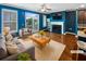 Bright living room with hardwood floors, fireplace, and sliding doors to outdoor deck, perfect for entertaining at 4954 Wyeth Way, Alpharetta, GA 30022