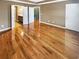 Large main bedroom featuring hardwood floors and ensuite bathroom and walk-in closet in neutral tones at 4954 Wyeth Way, Alpharetta, GA 30022