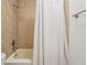 Bathroom with shower/tub combo and tiled walls at 1445 Monroe Ne Dr # A12, Atlanta, GA 30324