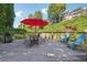 A spacious deck offers a great outdoor seating area with a table, chairs and umbrella at 1445 Monroe Ne Dr # A12, Atlanta, GA 30324