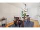 Elegant dining space featuring a wooden table and bench with modern pendant lighting at 1445 Monroe Ne Dr # A12, Atlanta, GA 30324