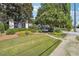 Well-manicured front lawn and sign welcome you to the charming Carette Heights community at 1445 Monroe Ne Dr # A12, Atlanta, GA 30324