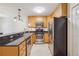 Modern kitchen features stainless steel appliances, granite countertops and tiled flooring at 1445 Monroe Ne Dr # A12, Atlanta, GA 30324