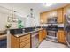 Charming kitchen with granite countertops, stainless steel appliances, tile backsplash and modern lighting at 1445 Monroe Ne Dr # A12, Atlanta, GA 30324